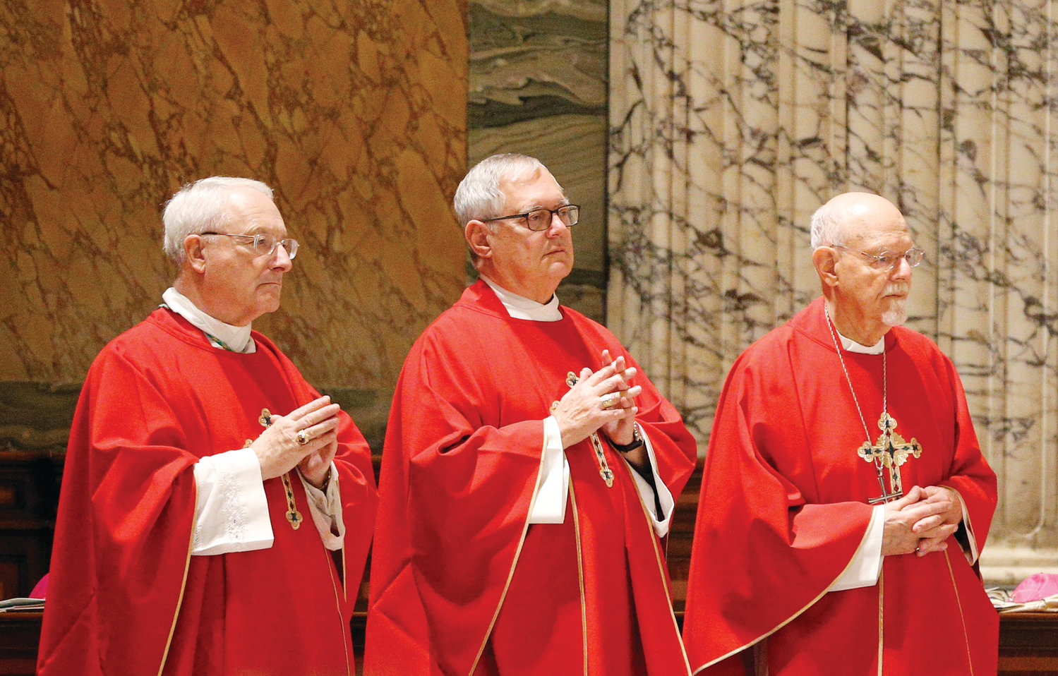 From left, Auxiliary Bishop Robert C. Evans, Bishop Thomas J. Tobin, and retired Auxiliary Bishop Peter A. Rosazza of Hartford, Conn., concelebrate Mass with other U.S. bishops from the New England States at the Basilica of St. Paul Outside the Walls in Rome Nov. 5. The bishops were making their “ad limina” visits to the Vatican to report on the status of their dioceses to Pope Francis and Vatican officials.